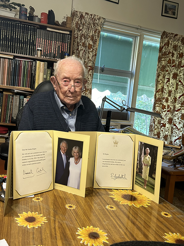 Gordon Biglin, 105 years old, proudly displays royal birthday cards from King Charles III and Queen Camilla.