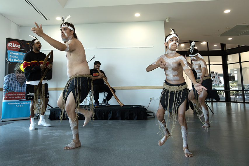 Traditional Indigenous dance performance at Rise’s 2024 NAIDOC celebration, with dancers in cultural attire.